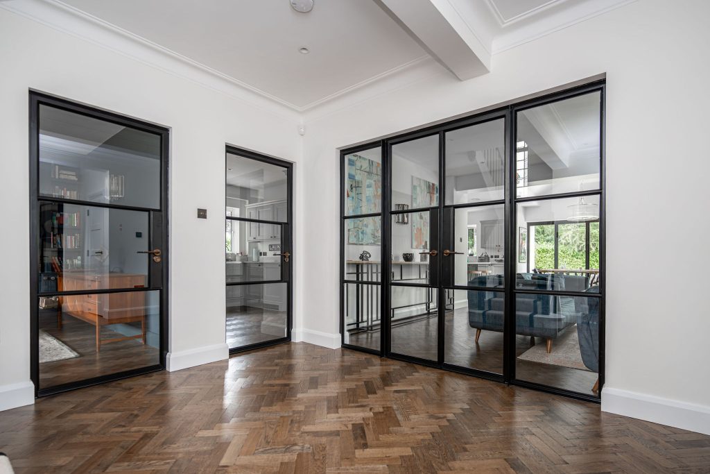 Black steel internal doors allowing a bright space