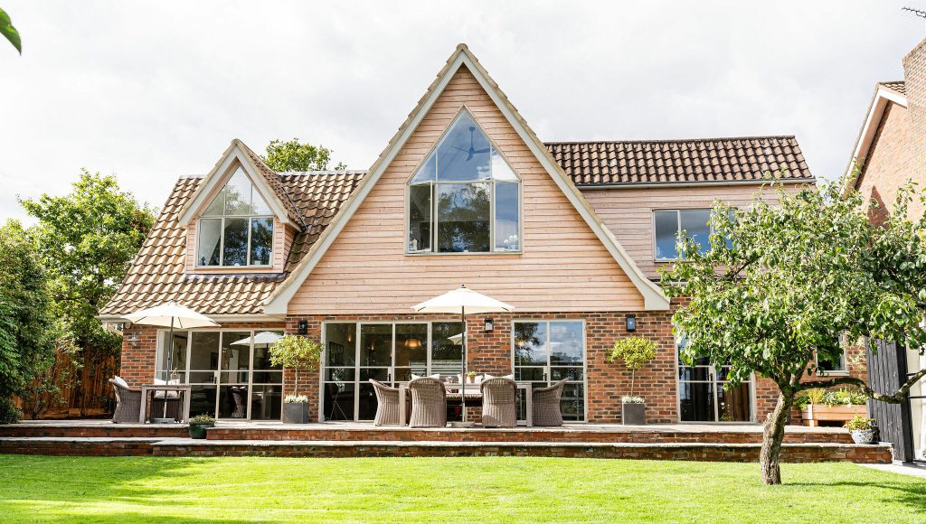 Full installation of light grey steel bespoke windows, casement windows, and french doors