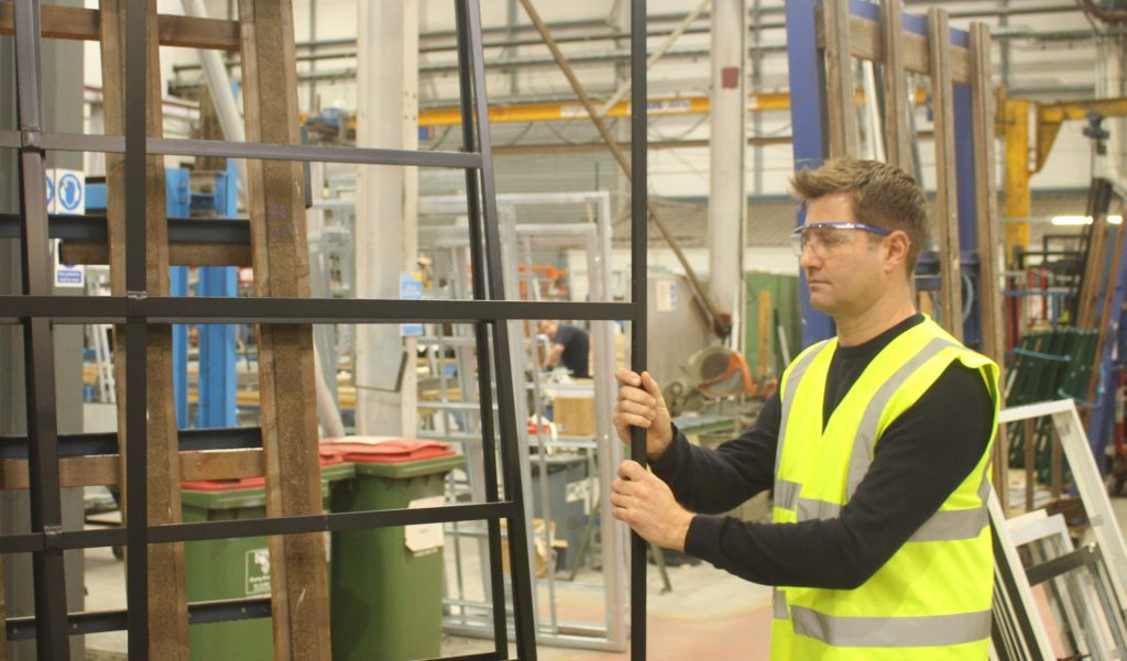 Crittall employee creating frames for renovation work